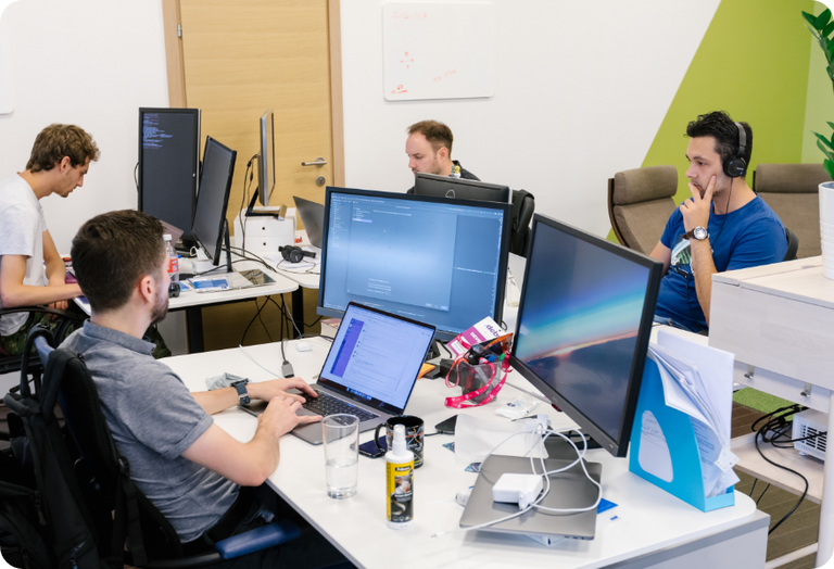 Kodius members working and cooperating in open-space