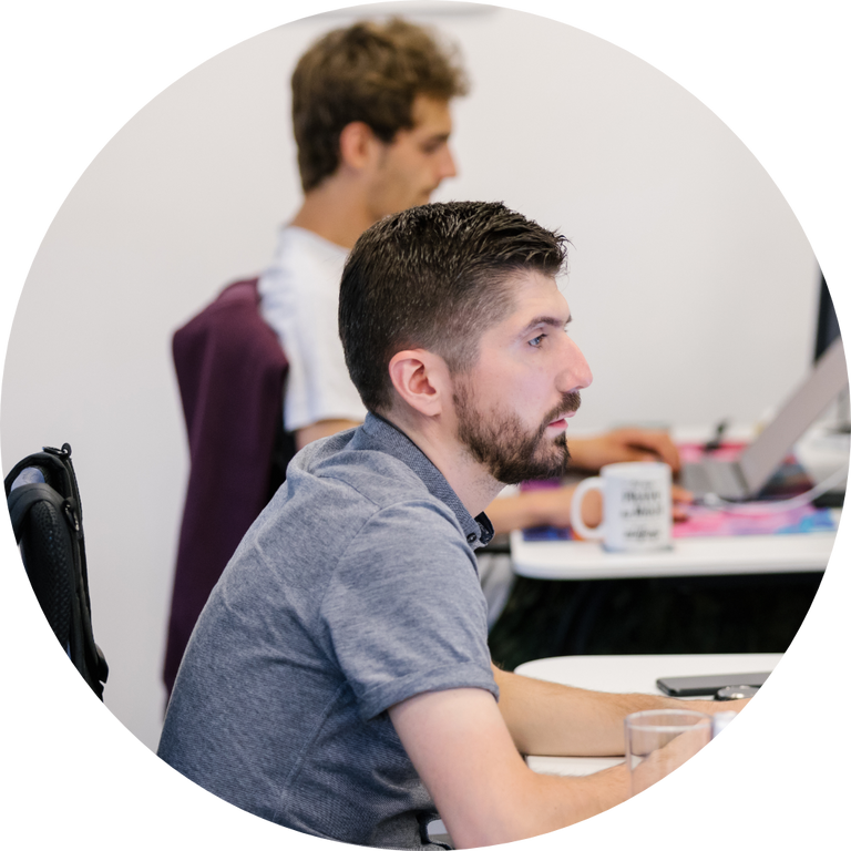 Step two image - Matija working on his laptop, at his work post